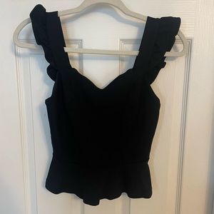 Navy Anthropologie crop shirt with ruffles.